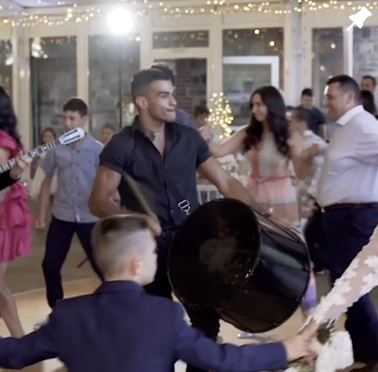 big drums being played at a wedding 