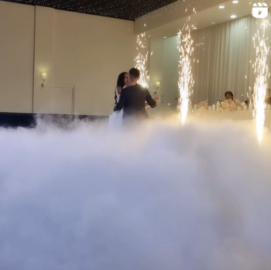 Married couple dancing on dry ice
